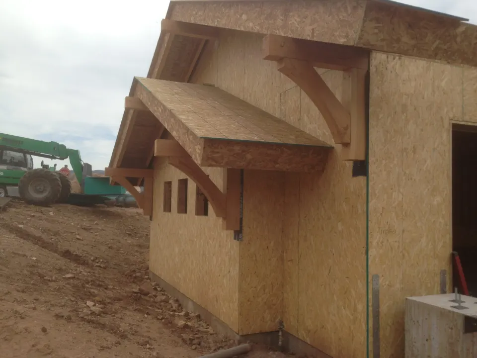 Timber brackets and sheathing on a structure under construction