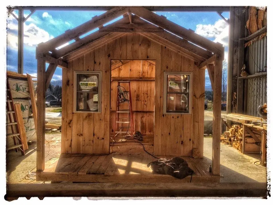 Small timber structure under construction in a workshop